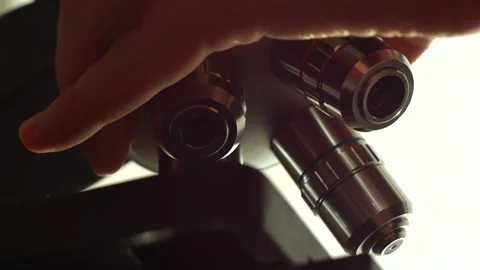 A scientist uses a microscope in the laboratory. Stock Footage 220337845