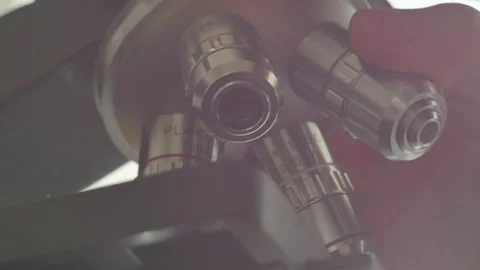 A scientist uses a microscope in the laboratory. Stock Footage 220337849