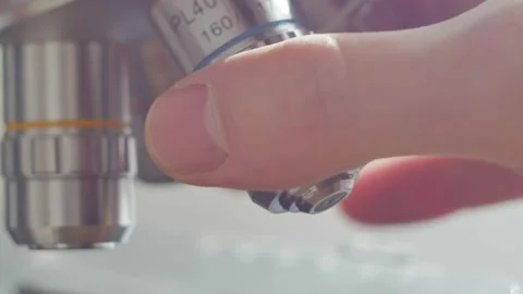 A scientist uses a microscope in the laboratory. Stock Footage 220337870