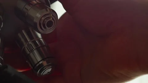A scientist uses a microscope in the laboratory. Stock Footage 220337959