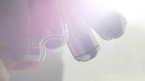 A scientist uses a microscope in the laboratory. Stock Footage 220337988