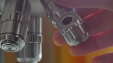 A scientist uses a microscope in the laboratory. Stock Footage 220337989