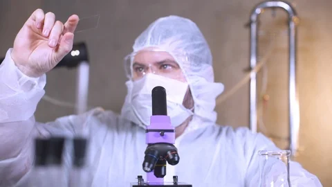 Scientist uses a microscope for scientific research. Researcher in laboratory. Stock-Footage 122763408