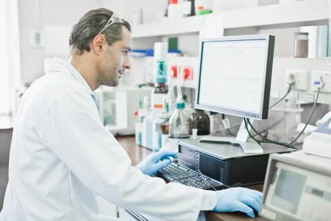 Scientist using computer in lab 스톡 사진