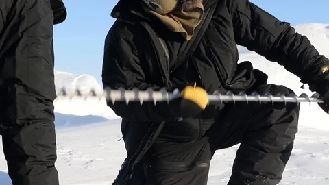 Scientist using drill on ice on Beaufort Sea, Arctic Circle Stock Footage 86895859