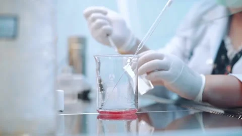 Scientist using dropper pipette transfer sample in Biosafety cabinet	 Stock Footage 134057855