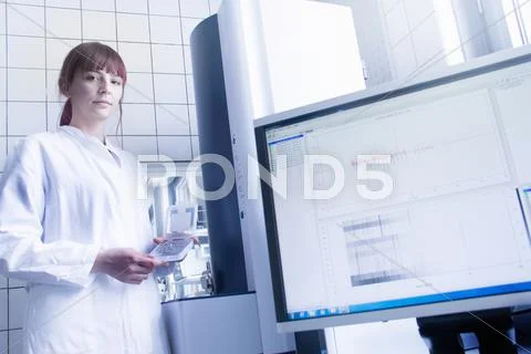 Scientist Using Equipment In Lab