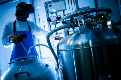 Scientist using gas tanks in lab 스톡 사진