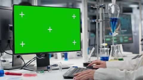 Scientist using green screen computer in laboratory, driving treatment discovery Stock Footage 320143385