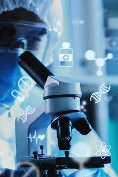 Scientist using a microscope to explore biological samples in a modern labo.. Stock Photos