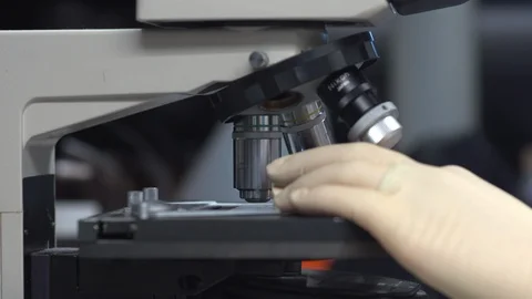 Scientist using a microscope Stock Footage 106900466