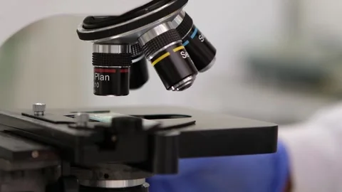 Scientist using the microscope Stock Footage 133378010