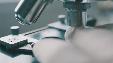 Scientist using a microscope in laboratory 스톡 동영상 59821283
