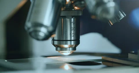 Scientist using microscope in laboratory Stock Footage 308859880