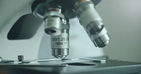 Scientist using microscope in laboratory Stock Footage 308859890