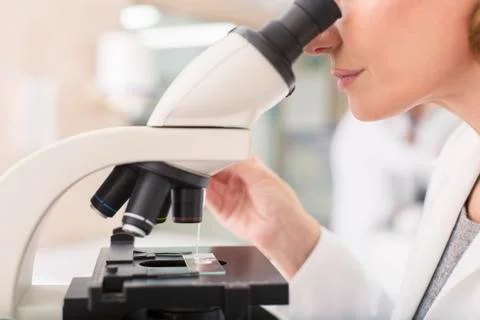 Scientist using microscope in laboratory Stock Photos