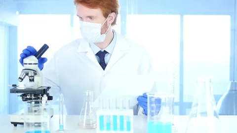 Scientist using Microscope in Laboratory for Research Video stock 80944684