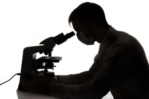 Scientist using microscope Stock Photos