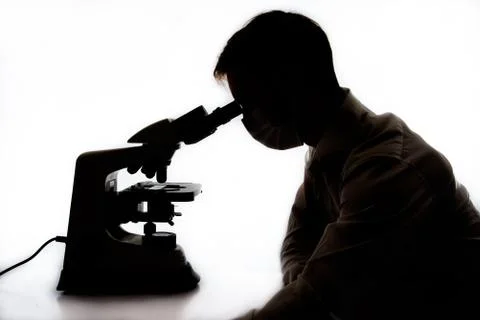Scientist using microscope Stock Photos