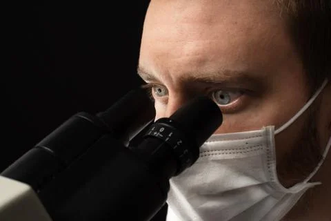 Scientist using microscope Stock Photos