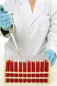 Scientist using pipette to extract samples Stock Photos