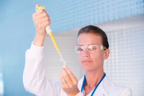 Scientist using pipette Stock Photos