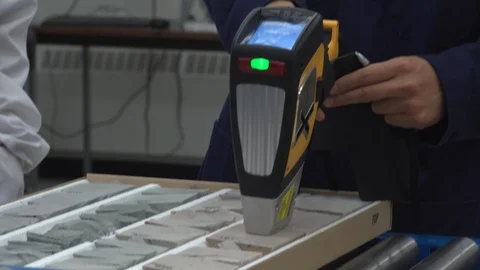 Scientist using a sensor to test materials Stock Footage 106900021