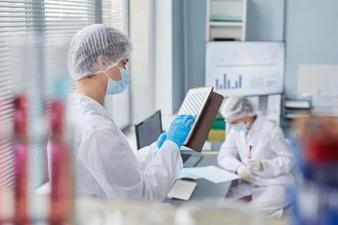 Scientist using tablet pc at the lab Stock Photos