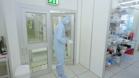 Scientist Walking Through Nano Technology Cleanroom Facility Stock Footage 92864366