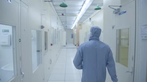 Scientist Walking Through Nano Technology Cleanroom Facility Stock Footage 92864495
