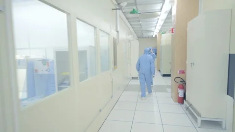 Scientist Walking Through Nano Technology Cleanroom Facility Stock Footage 92864828