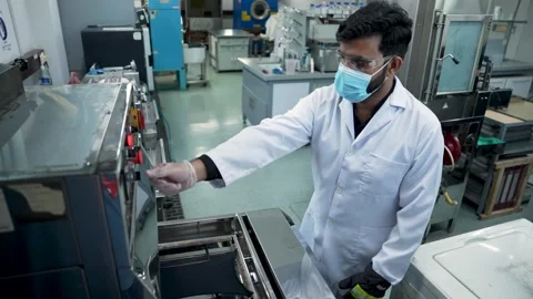 Scientist Wearing A Lab Coat And Safety Equipment Testing Fabric For Chemical Stock Footage 334190062