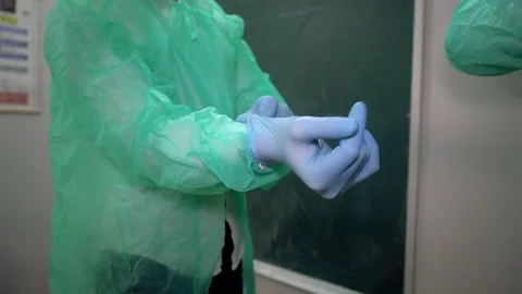 The scientist wipes the gloves Stock Footage 123666256