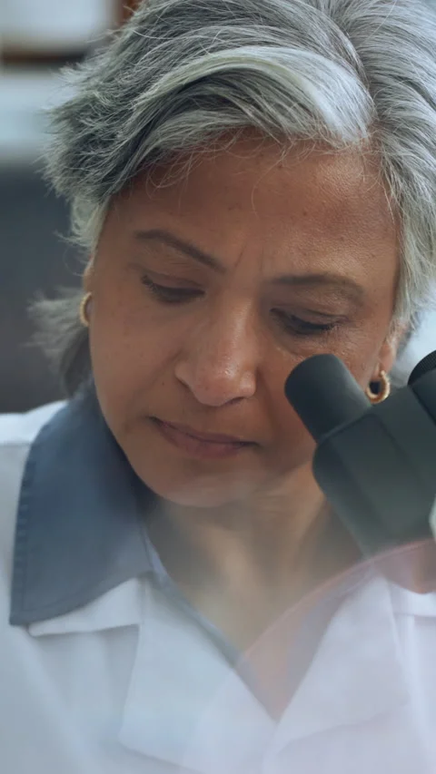 Scientist, woman and microscope in lab for biotech, sample inspection and stem Stock Footage 320051147
