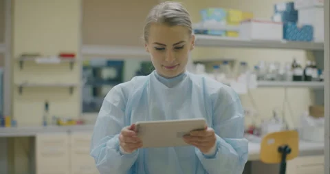 Scientist Woman Using Digital Tablet in Medical Laboratory Stock Footage 318593807