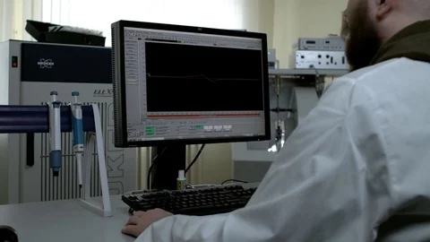 Scientist working with analysis dna software on computer in the genetic Stock Footage 77617823
