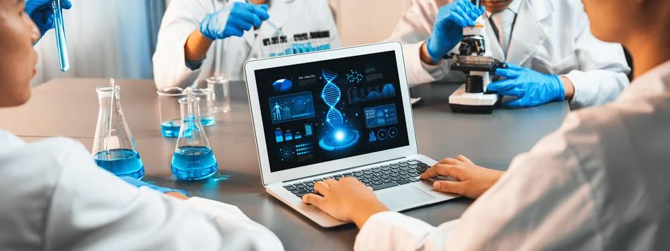 Scientist working on biotechnology computer software to study DNA. Neoteric Stock Photos