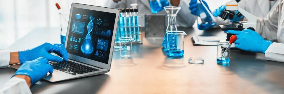 Scientist working on biotechnology computer software to study DNA. Neoteric Stock Photos