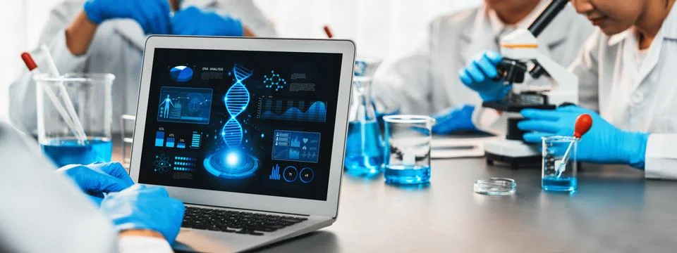 Scientist working on biotechnology computer software to study DNA. Neoteric Stock Photos