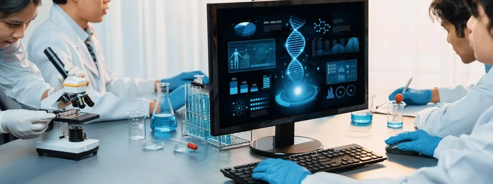 Scientist working on biotechnology computer software to study DNA. Neoteric Stock Photos
