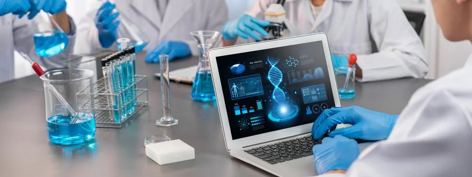 Scientist working on biotechnology computer software to study DNA. Neoteric Stock Photos
