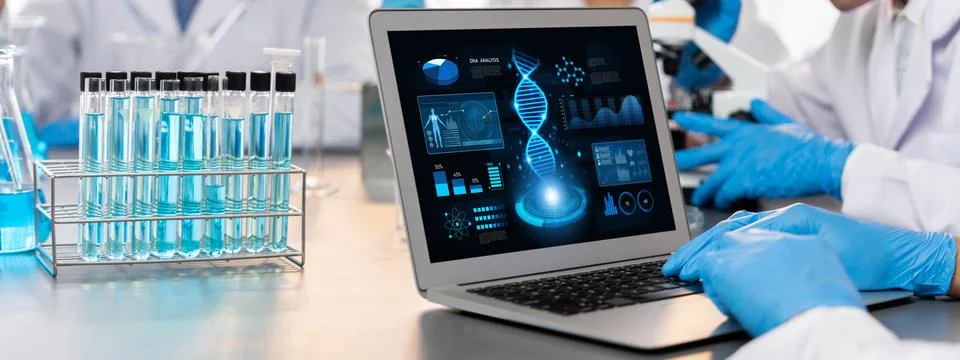 Scientist working on biotechnology computer software to study DNA. Neoteric Stock Photos
