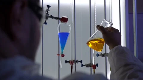 Scientist working with chemicals in laboratory. Video stock 159743817