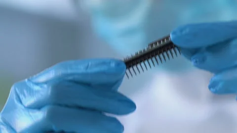 Scientist working on creation of nanochip for artificial intelligence to robots Stock Footage 88518961