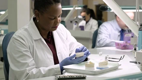 Scientist working on dental model Stock Footage 77078797