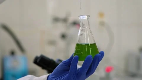 Scientist working with green substance Stock Footage 133375707