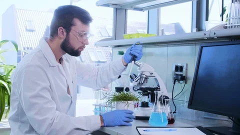Scientist working in lab. Doctor making microbiology research. Biotechnology Stock Footage 115842152