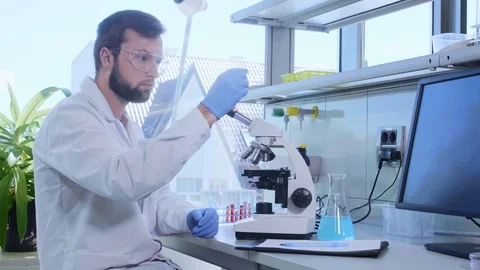 Scientist working in lab. Doctor making microbiology research. Laboratory tools Stock Footage 116563206