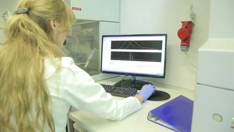 Scientist working in the laboratory with DNA and blood Stock Footage 136400393