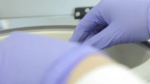 Scientist working in the laboratory with DNA and blood Stock Footage 136400447